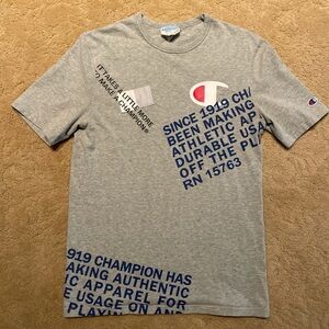 Champion gray T-shirt withh black, navy, white, and red detail